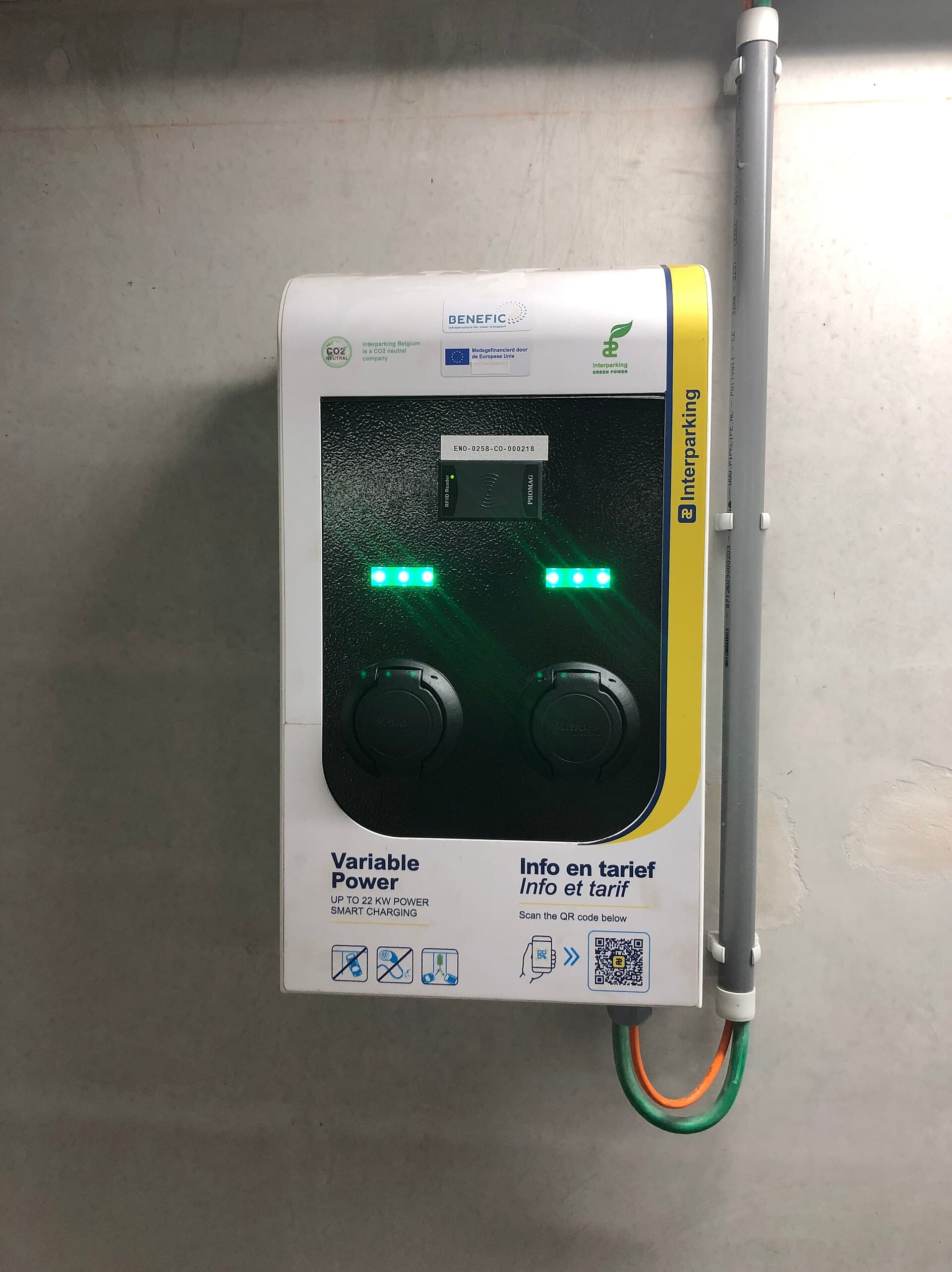 Electric vehicle charging station in a parking garage