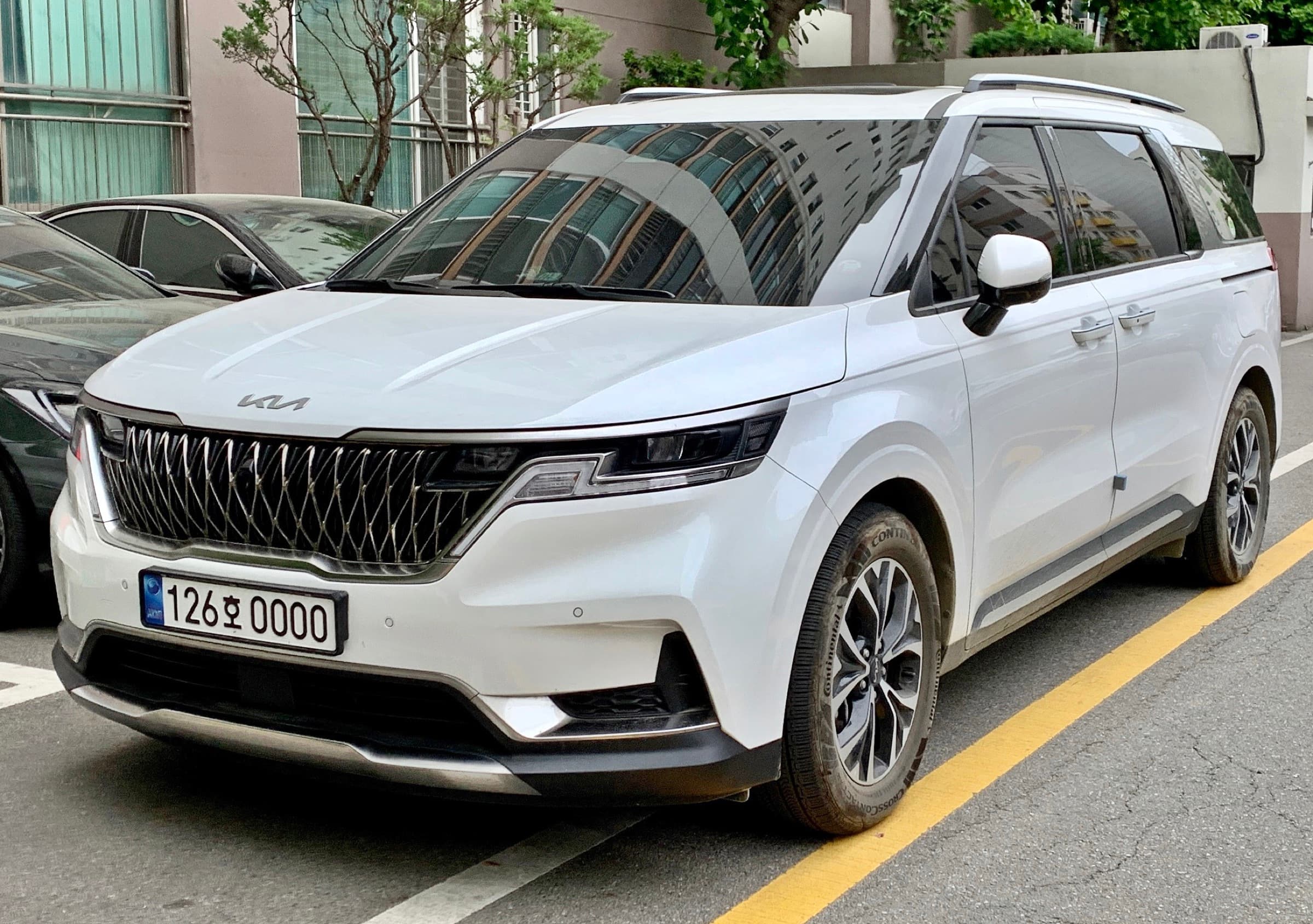 Kia Carnival KA4 minivan parked outdoors