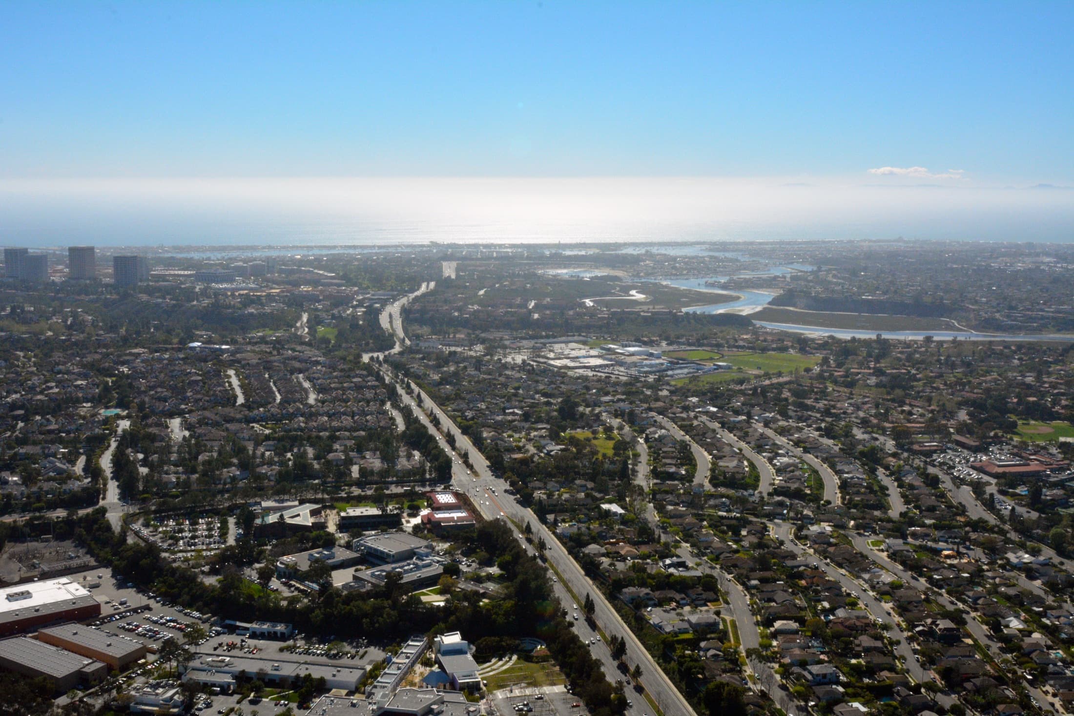 Aerial view looking south along Jamboree Road toward Newport Beach and the Pacific