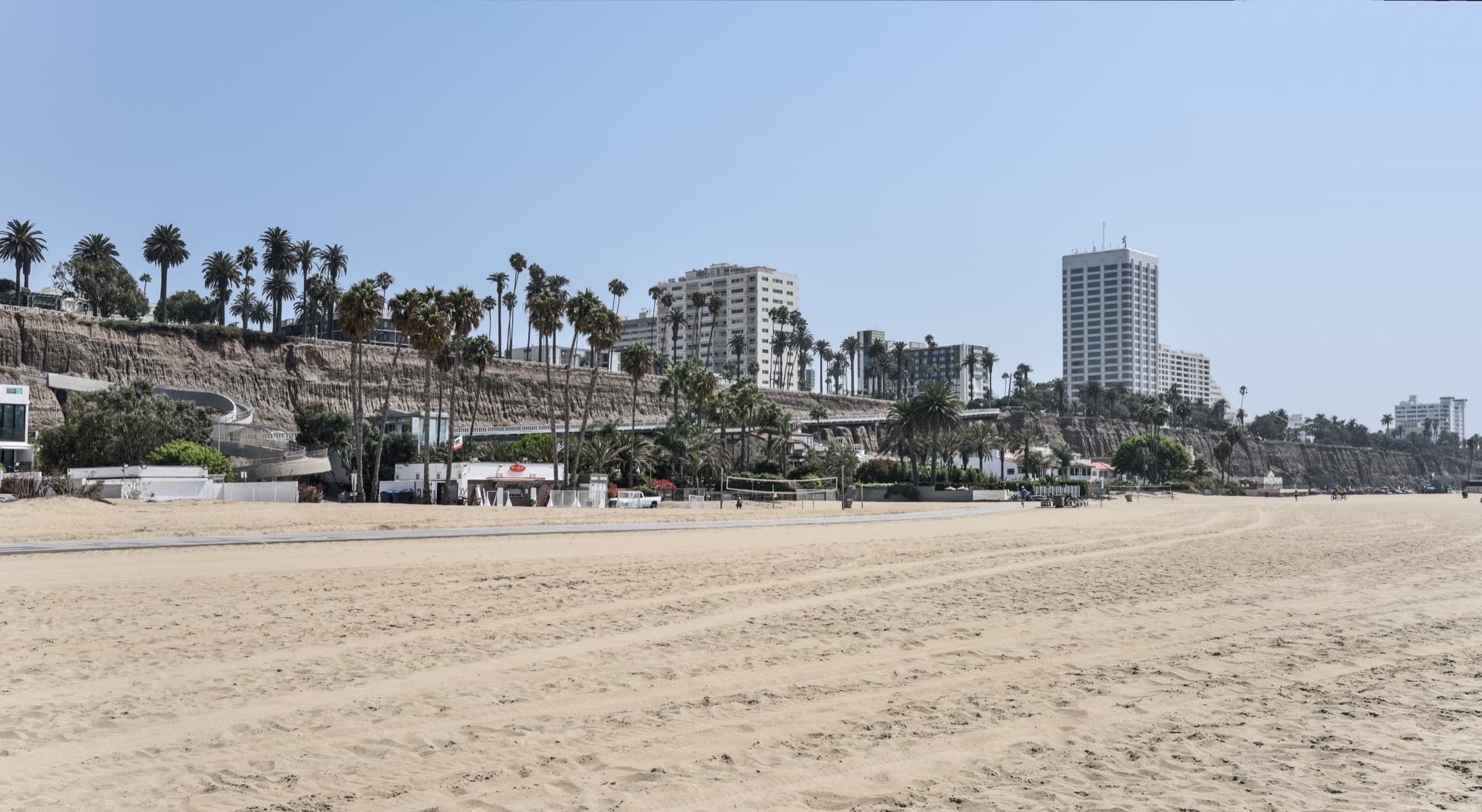 Santa Monica State Beach and coastal sandstone bluffs under clear light