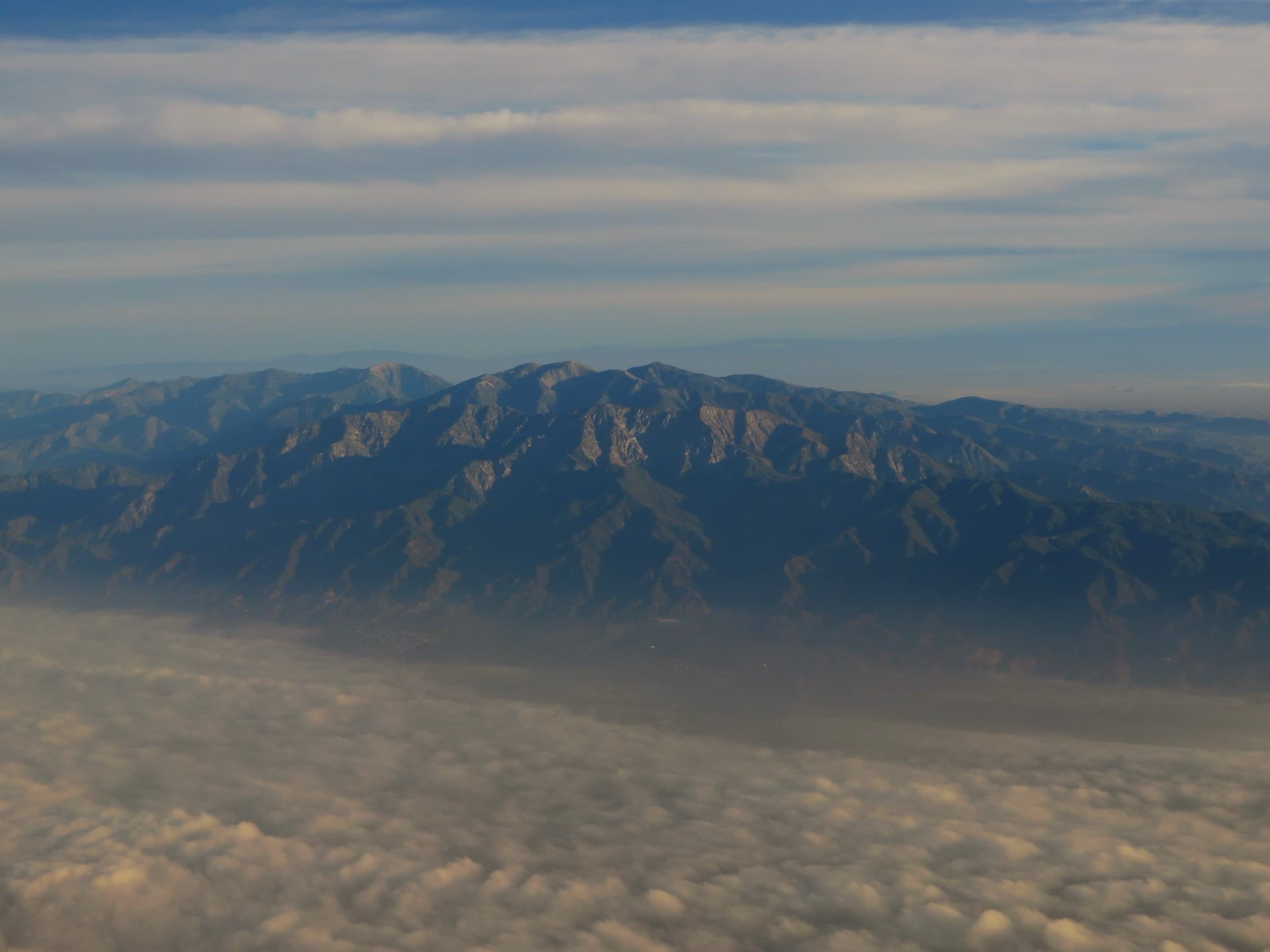 San Gabriel Mountains rising above a foggy San Gabriel Valley in the Los Angeles basin