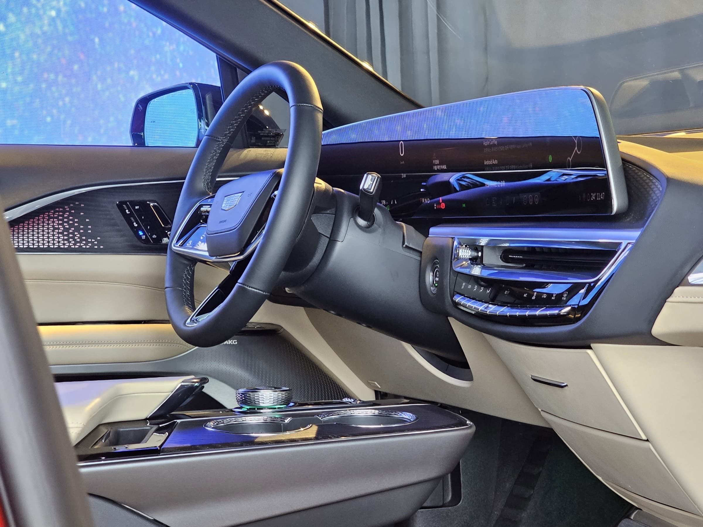 Cadillac Lyriq cabin with wide curved touchscreen and leather seats