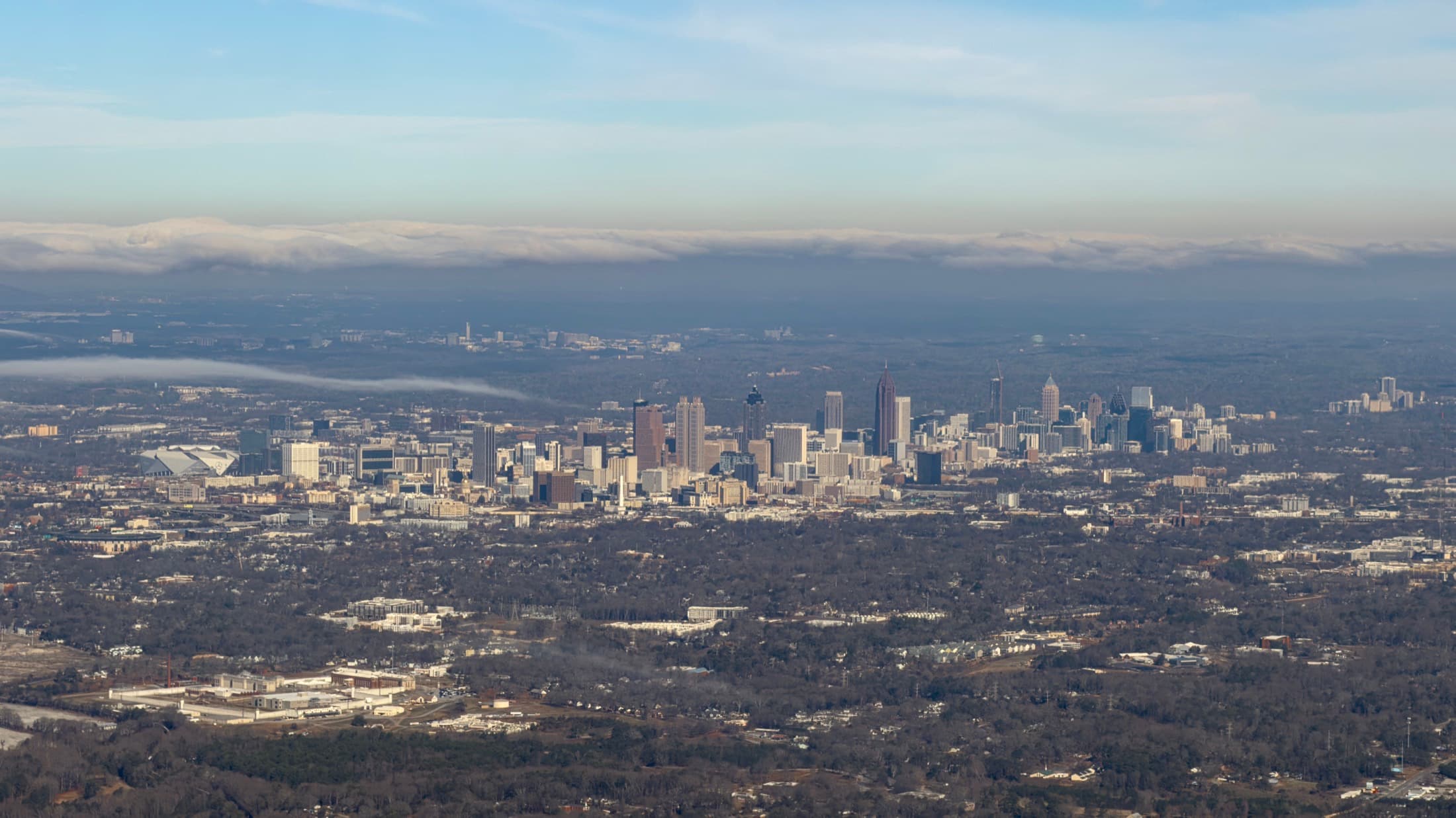 Aerial view of the Atlanta skyline under clear skies