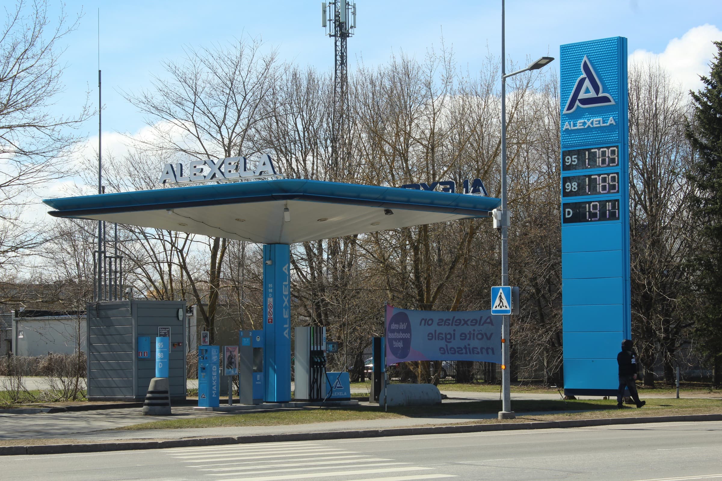 Highway gas station with illuminated fuel price display