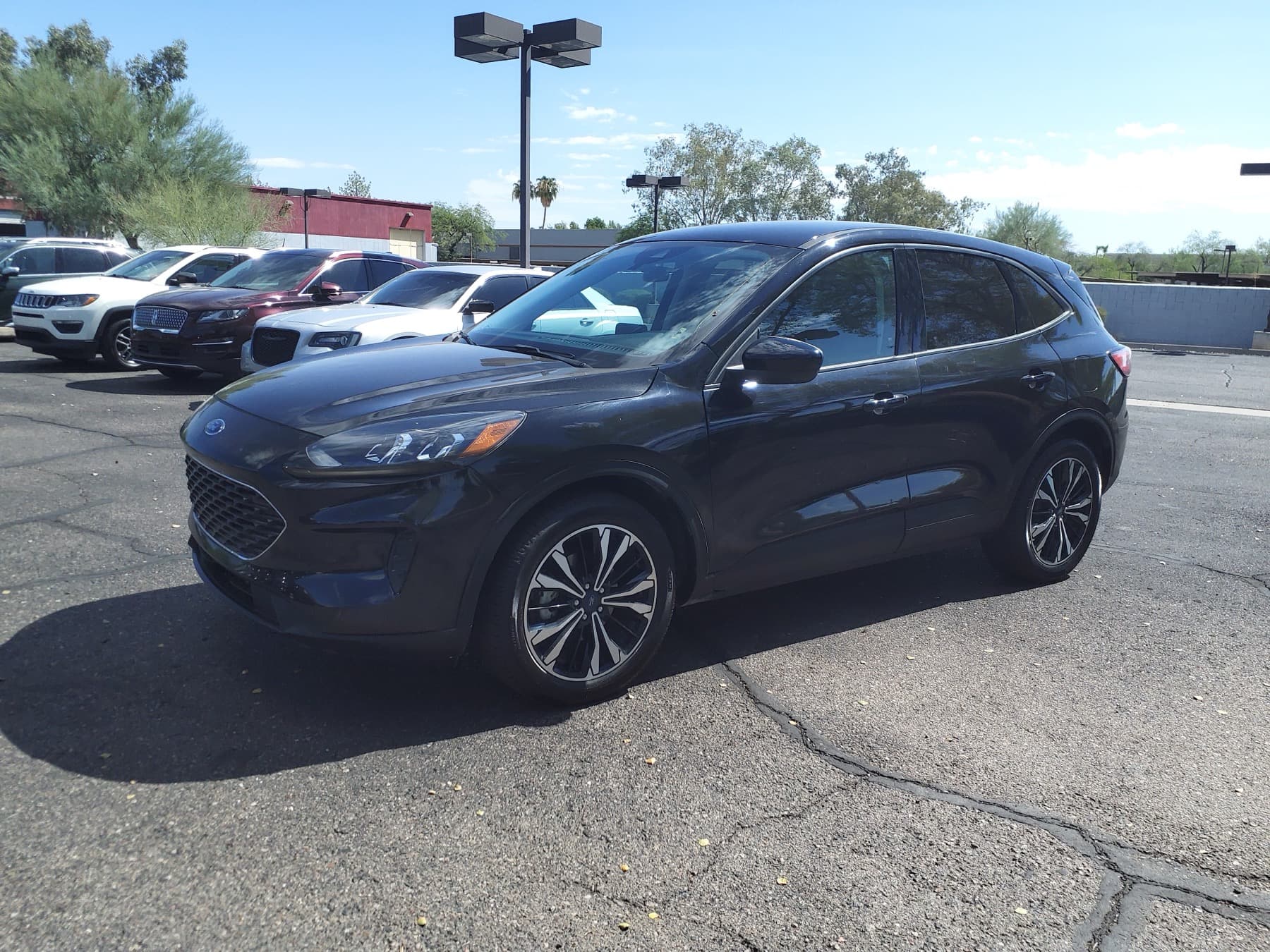 2022 Ford Escape Hybrid SE on a dealer lot in three-quarter front view