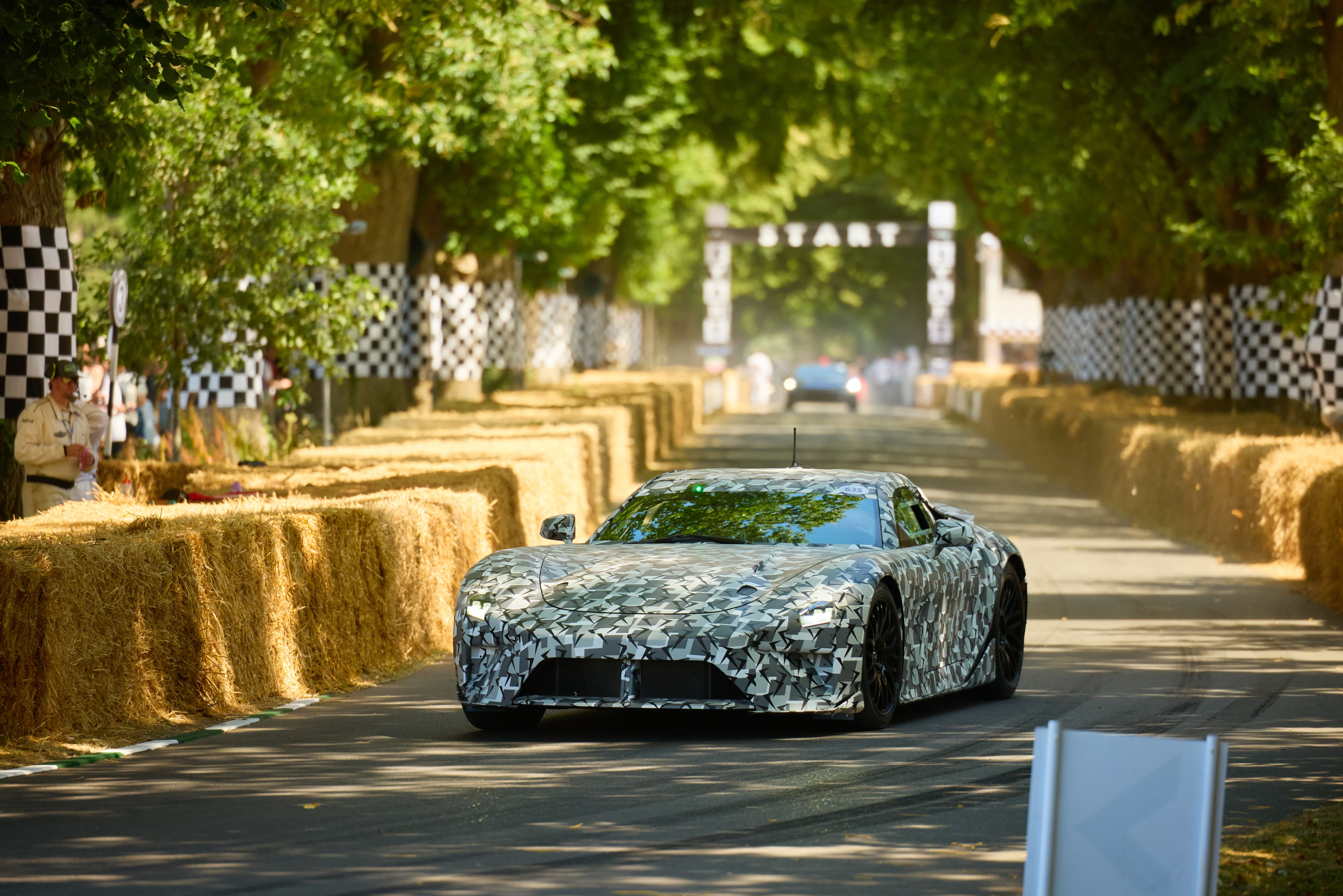 Camouflaged Lexus LFA Concept driving up the Goodwood hill-climb course