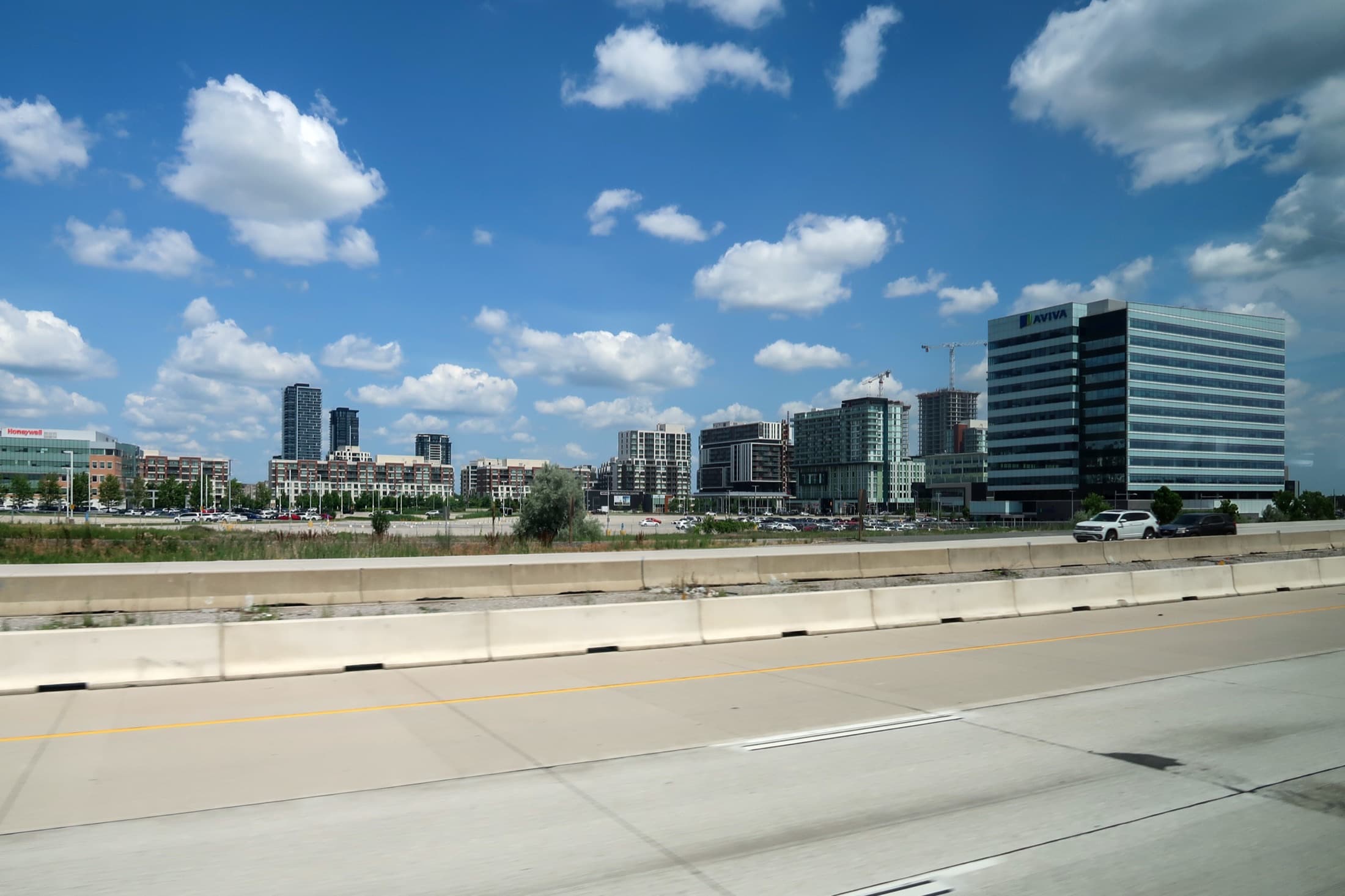 Downtown Markham skyline with condo towers and the Aviva office building seen from Highway 407