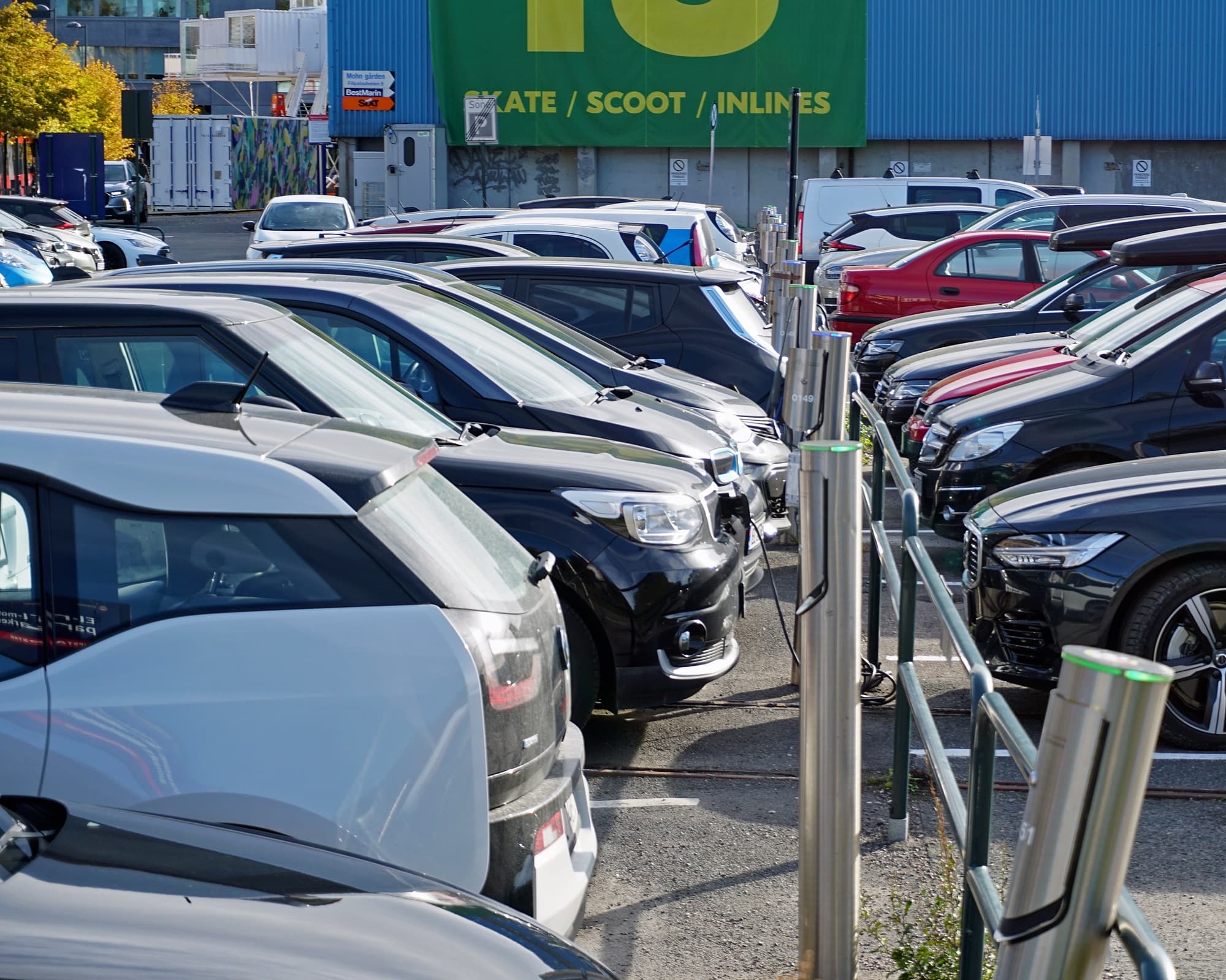 Electric cars charging at a dedicated free EV parking lot in Oslo, Norway