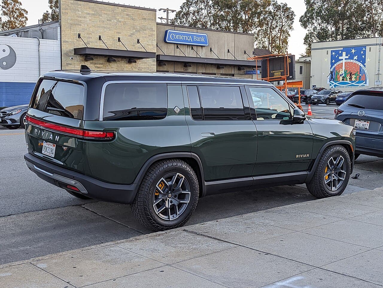 Rivian R1S electric SUV parked on a suburban street