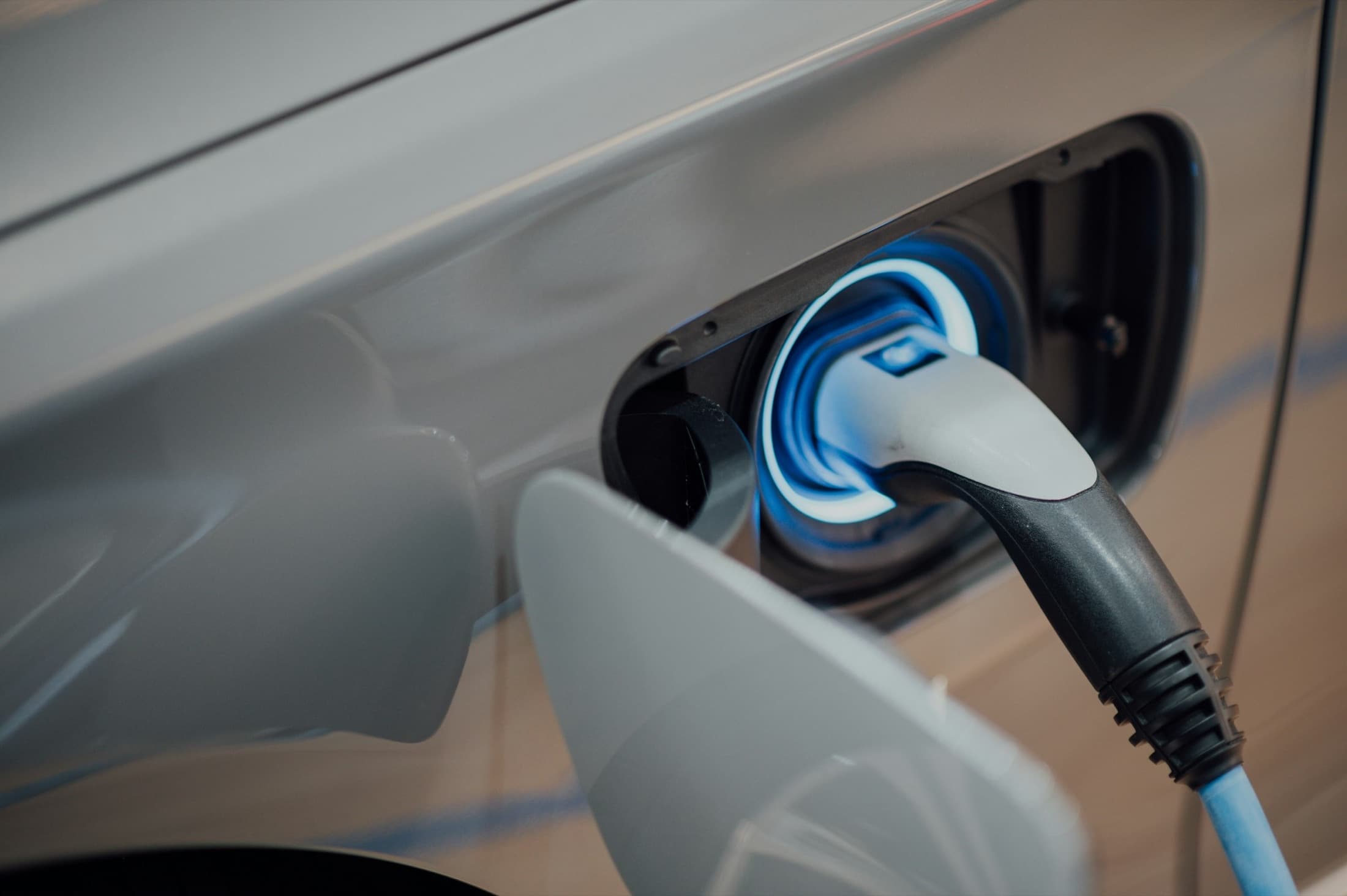 Electric vehicle plugged into a public DC fast charger