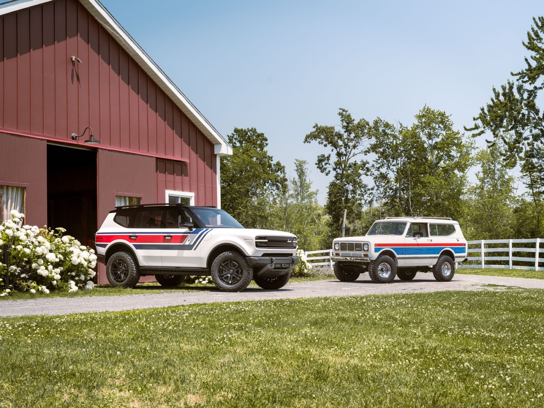 Scout Traveler Spirit of ’26 concept beside a vintage Spirit of ’76 Scout II