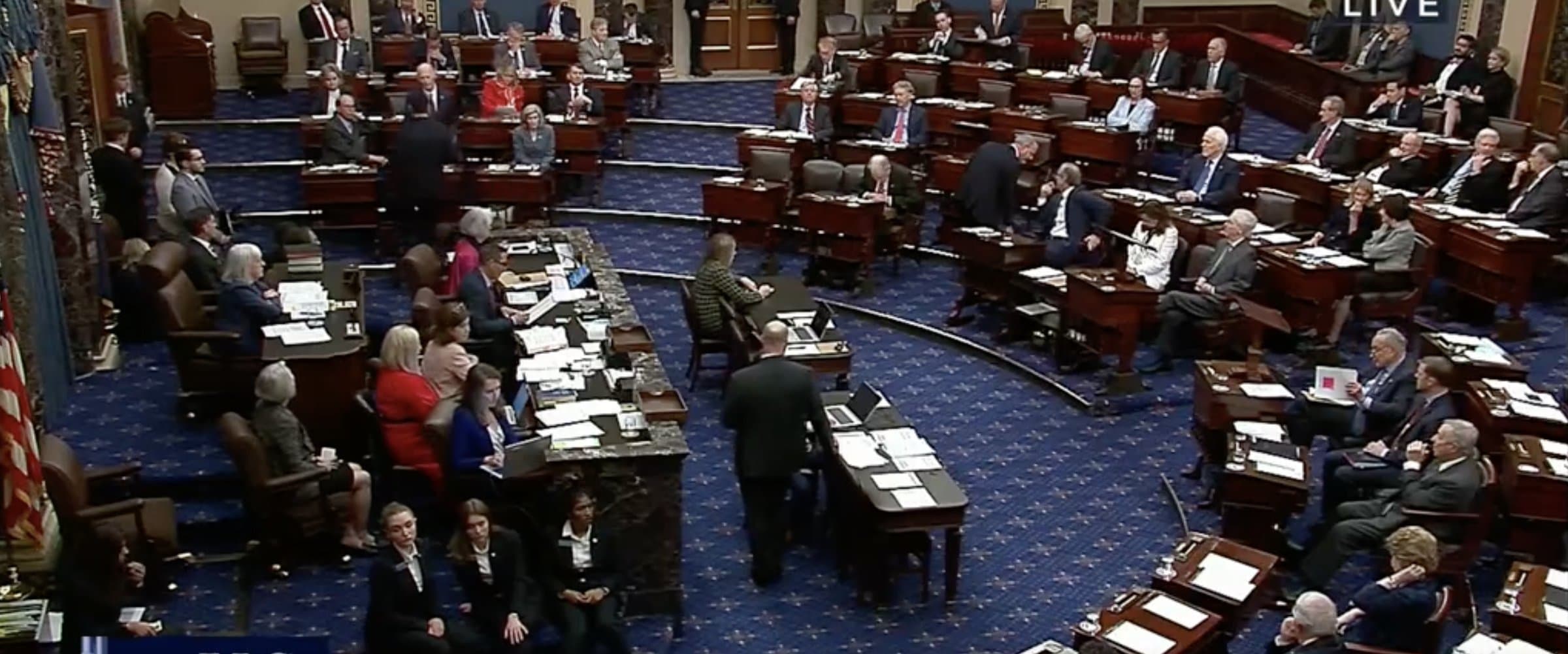 The U.S. Senate chamber in session, desks arranged on the blue carpeted floor