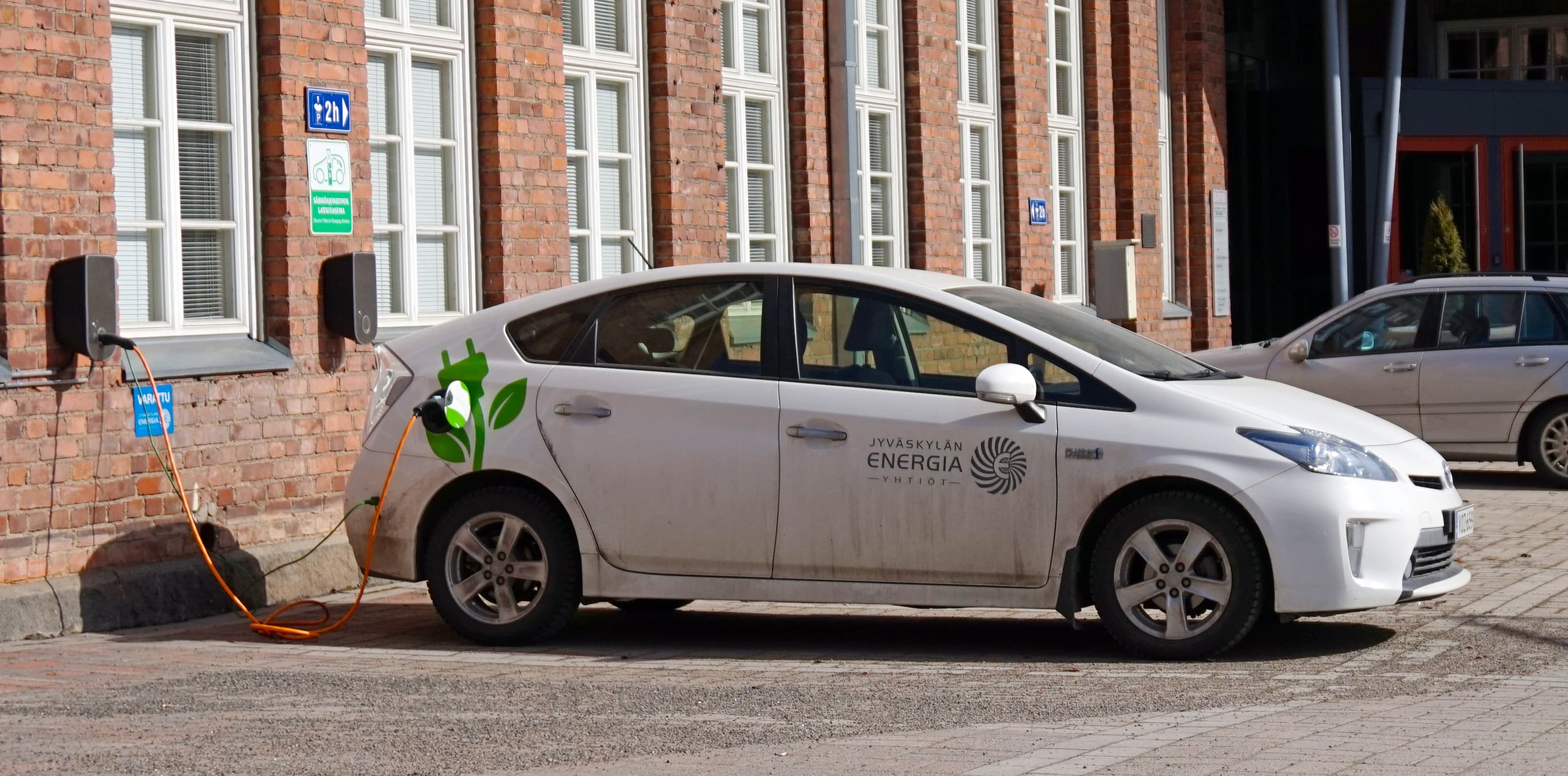 Toyota Prius Plug-in Hybrid connected to a public Level 2 charging station