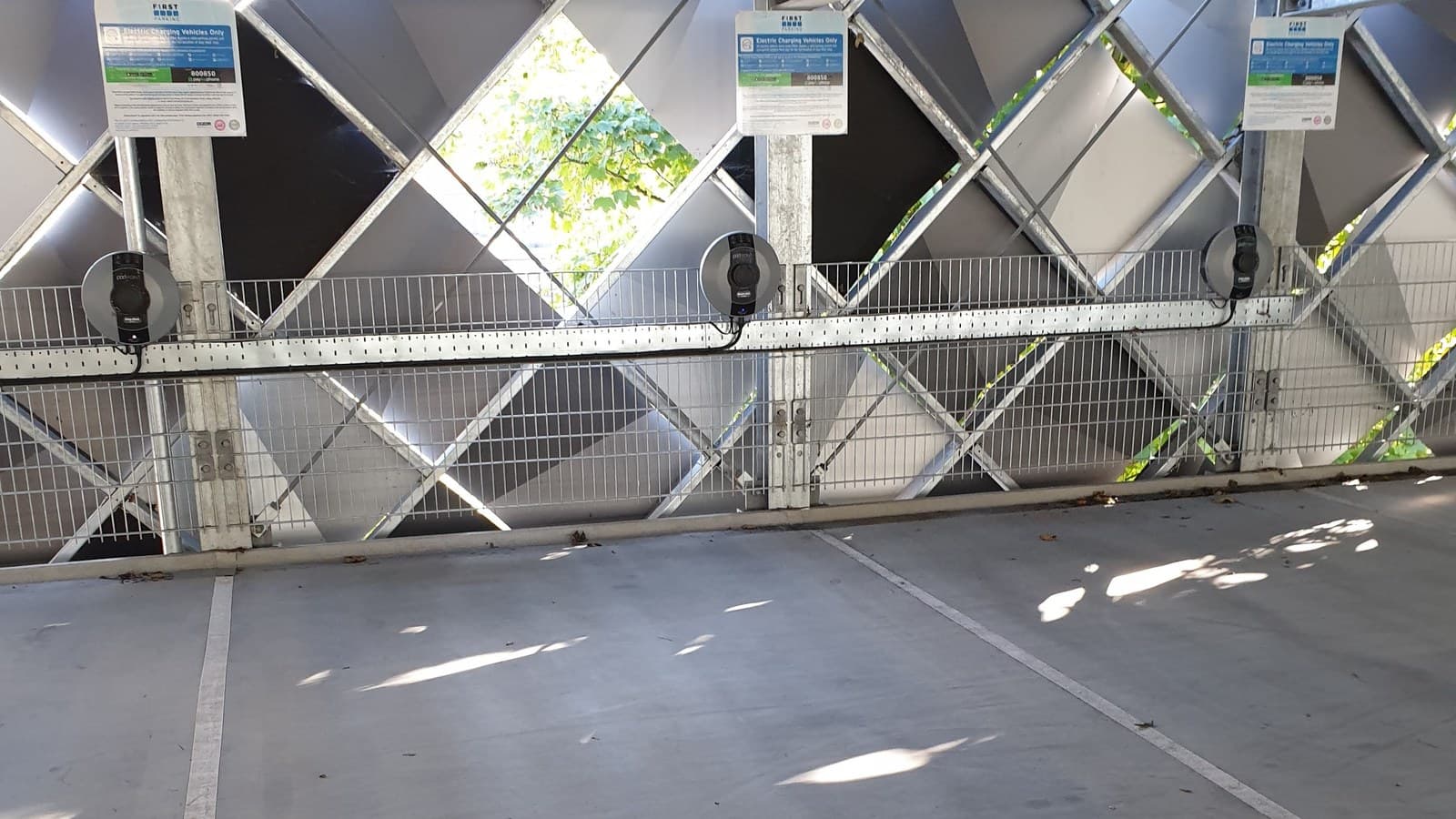 Shared Level 2 EV charging stations in a parking structure