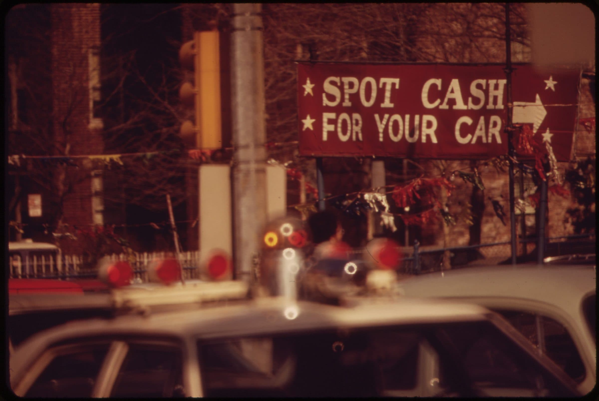 Small used car lot on Queens Boulevard near the Midtown Tunnel