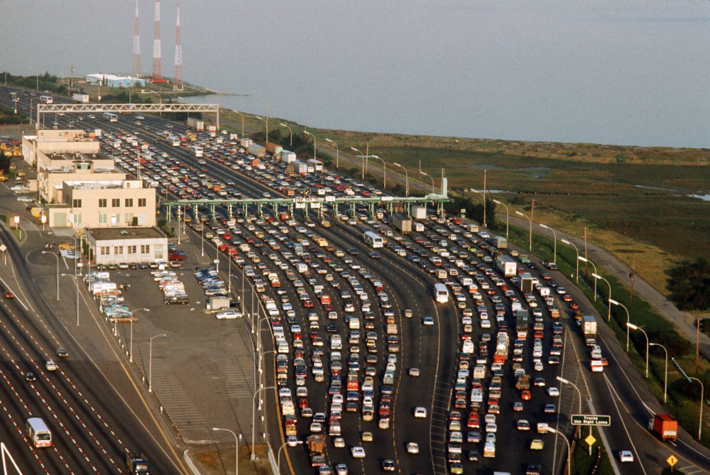 Historic view of cars approaching the San Francisco-Oakland Bay Bridge toll plaza