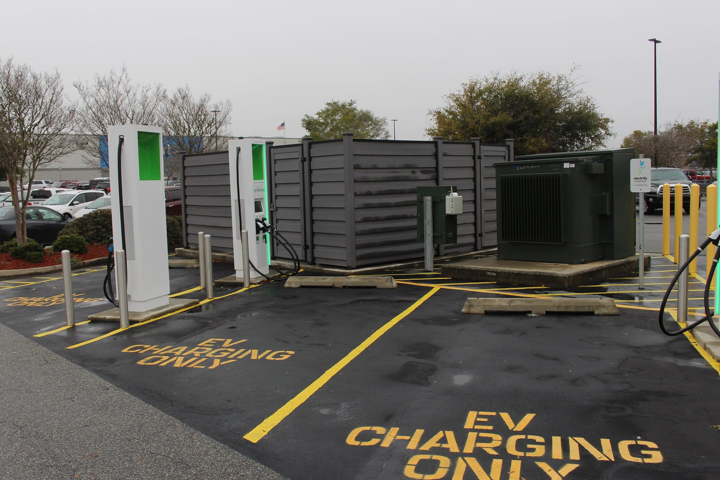 Electrify America DC fast-charging stalls at a highway-adjacent station
